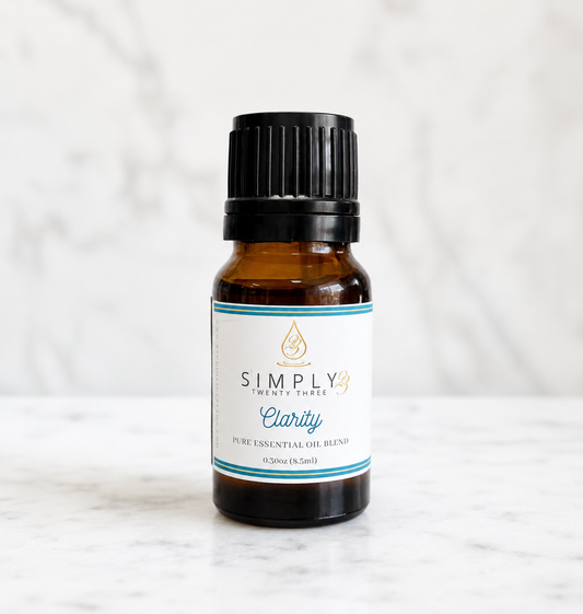 Simply 23 Clarity pure essential oil blend in an amber glass bottle.
